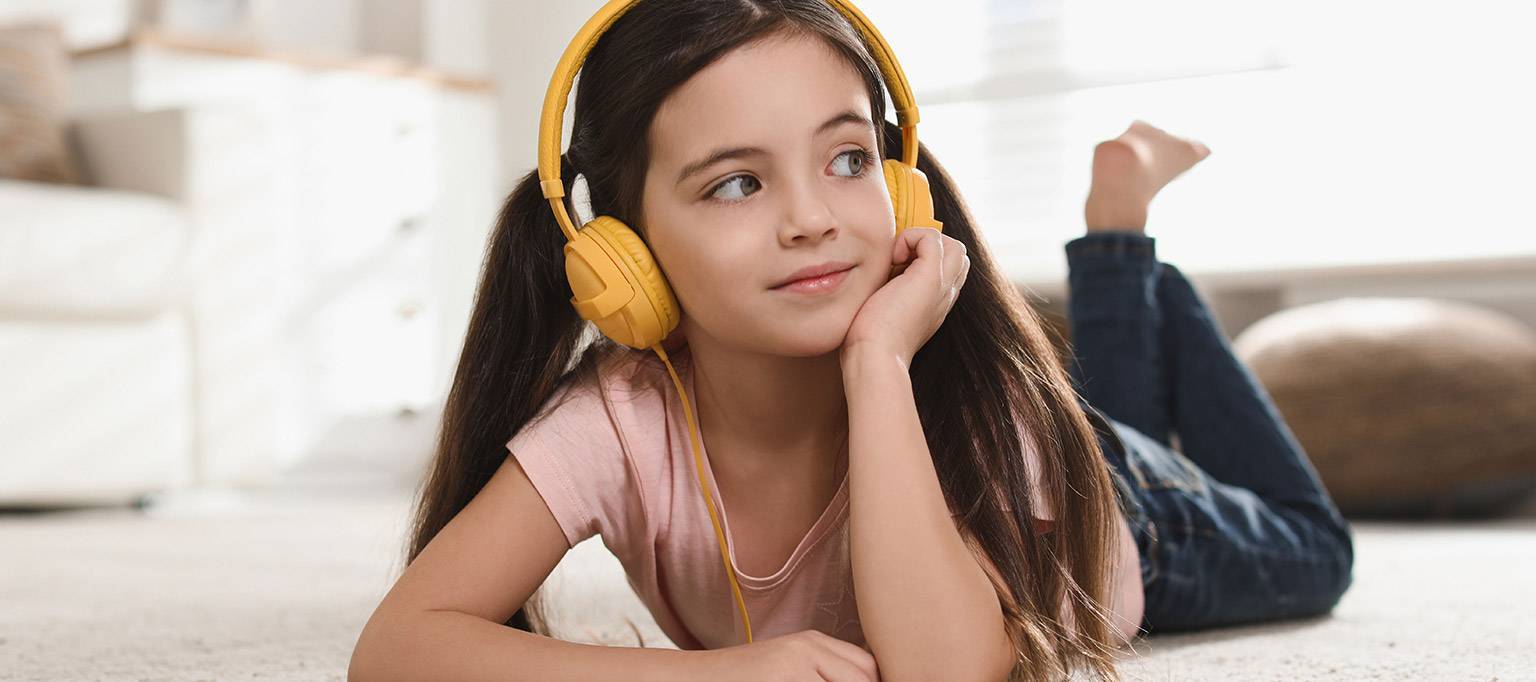 girl having hearing levels tested with headphones